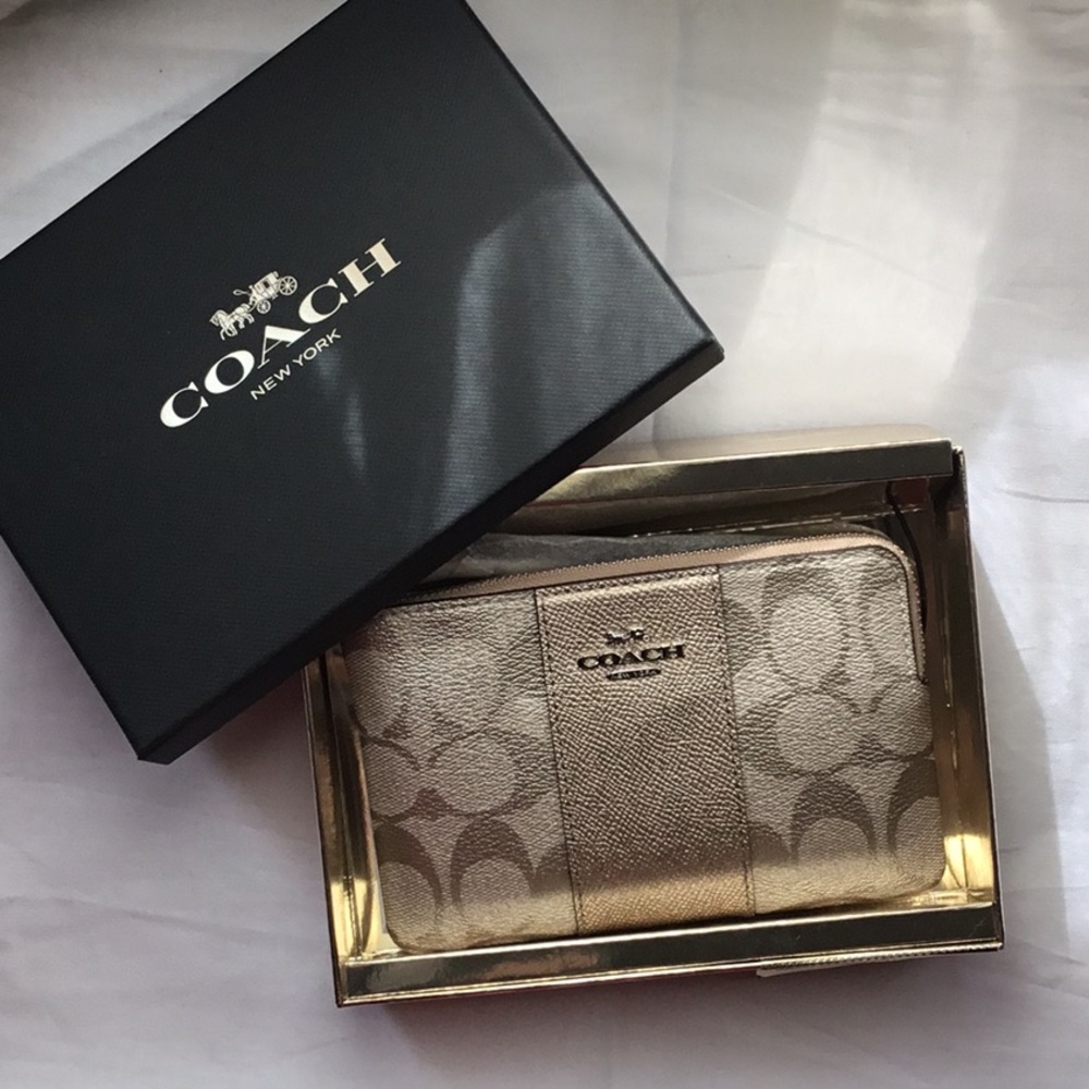 Coach wristlet in gold NWT original box